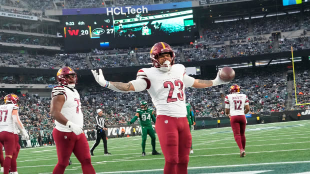Washington Commanders running back Chris Rodriguez Jr. (23) celebrates a second half touchdown against the New York Jets at MetLife Stadium. Mandatory Credit: Robert Deutsch-USA TODAY Sports
